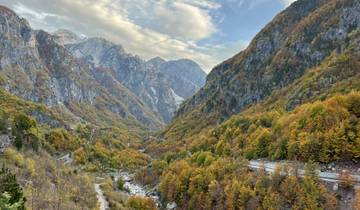 Vibrant autumn colors in a mountainous valley.