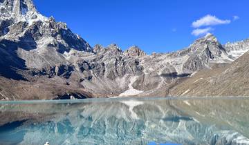 Scenic mountain lake reflecting the surrounding peaks.