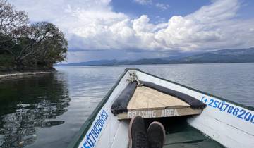 Relaxing boat ride with view of mountains and water.