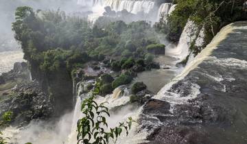 Breathtaking view of cascading waterfalls surrounded by lush vegetation.