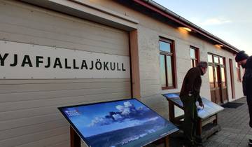 People examining educational panels about Eyjafjallajokull