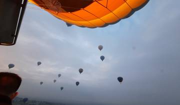 Hot air balloons floating in the sky at Cappadocia.