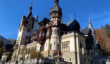 Exterior view of a grand castle on a clear day.