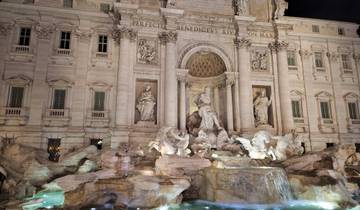Trevi Fountain illuminated at night in Rome.