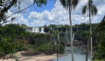 Stunning waterfall landscape surrounded by lush greenery.