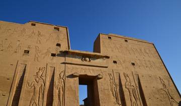 A large historical temple structure with intricate sandstone carvings.