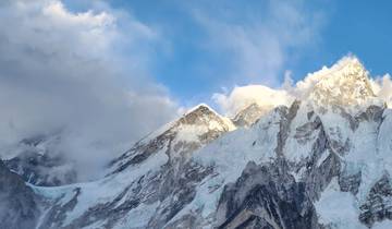 Snow-capped mountain peaks under a clear blue sky.