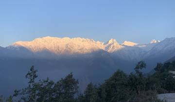 Snow-capped mountain range with a clear blue sky.
