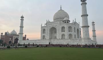 Iconic white mausoleum with dome and minarets.