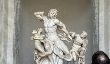 Famous ancient sculpture displayed indoors.