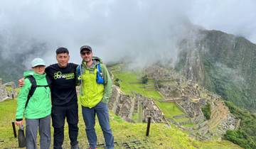Three people with Machu Picchu in the background.
