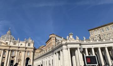 St. Peter's Basilica and square under a clear blue sky.