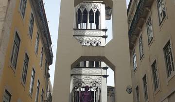 An iconic city elevator structure between buildings.
