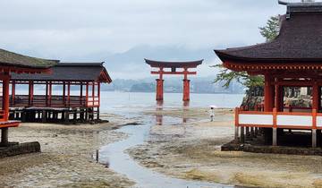 Scenic view of Itsukushima Shrine with iconic torii gate in Hiroshima.