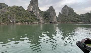 Halong Bay with limestone karsts and calm water.