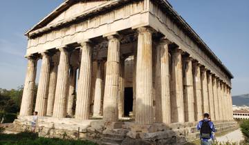 Temple of Hephaestus with columns and visitors.