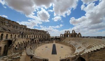 An ancient amphitheater with a dramatic sky.