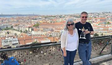 Couple with a view over the city of Lisbon.