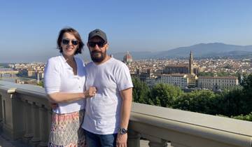 Couple posing with a panoramic view over Florence.