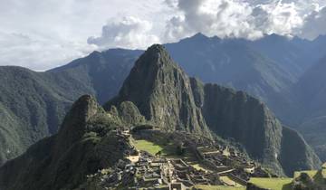 Machu Picchu ruins with Huayna Picchu in the background.