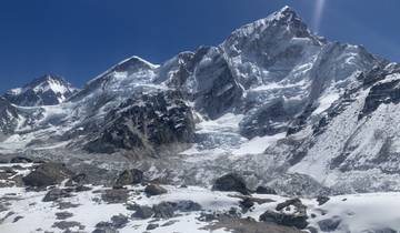 Impressive view of snow-covered mountains and rocky terrain.