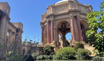 Classical architectural structure surrounded by greenery.