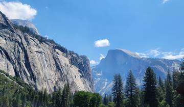 Dramatic mountain peaks under a clear blue sky.