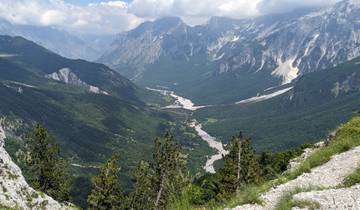 Valley with river and surrounding mountainscape.
