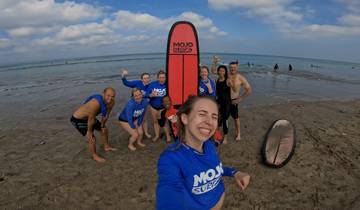 Group enjoying a day surfing at the beach.