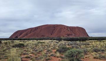 Distant view of Uluru with cloudy sky