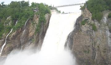 A grand waterfall cascading down rocky cliffs.