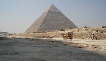 Pyramid with people and a horse-drawn cart.