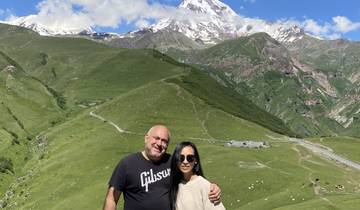 Couple with a mountainous backdrop.