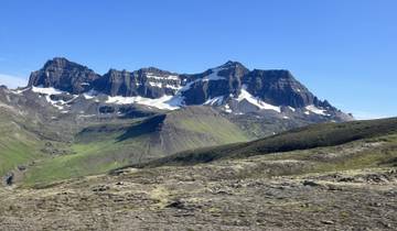 Snow-capped mountains in a rugged landscape.