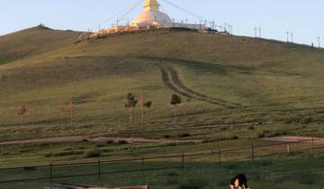 Hill with a structure at the top, tracks leading up.