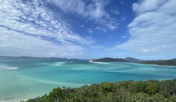 Vast ocean view with turquoise waters under a blue sky.