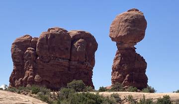 Balanced rock formations in a desert landscape.