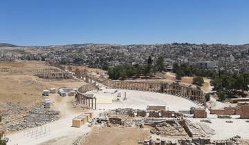 Panoramic view of a large ancient amphitheater in Jerash, Jordan.