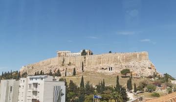 The Acropolis in Athens under a clear blue sky.