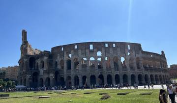 The Colosseum in Rome with tourists in the foreground.