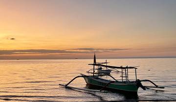 Boat on the water during a colorful sunset.