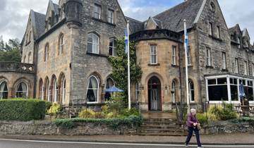 Historic stone building with arched windows.