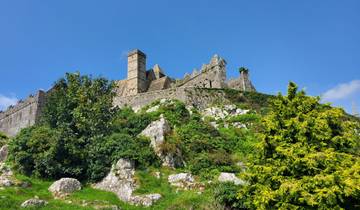 Fortified stone building on a hillside.