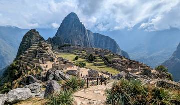 Iconic view of Machu Picchu with ancient ruins and mountain backdrop.