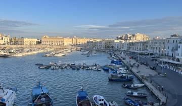 Harbor view with boats and buildings.