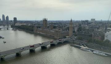 Aerial view of the River Thames with the Houses of Parliament and Elizabeth Tower in London.