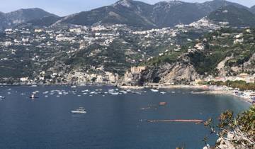 Expansive view of Amalfi Coast with mountains and sea.