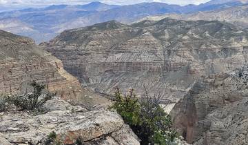 Mountain range under a partly cloudy sky.