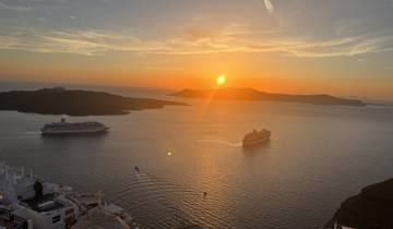 Sunset view over the ocean with cruises.