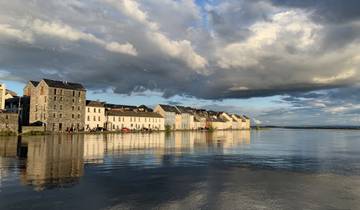 Charming row of houses alongside a reflective river